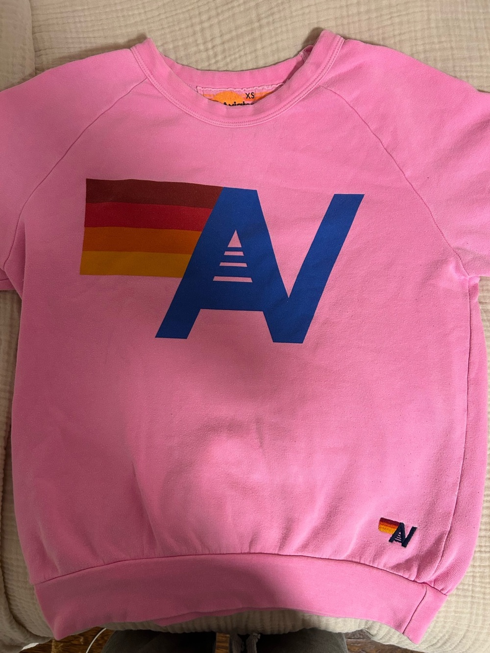 Aviator Nation Pink Sweatshirt with Blue AV Logo and Rainbow Stripes